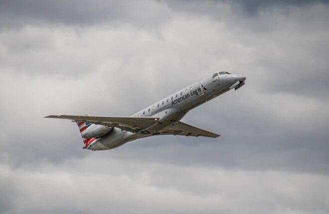 ERJ-145 taking off, cloudy background, day