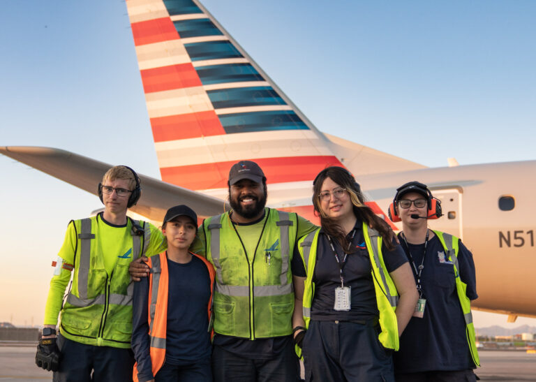 Piedmont Airlines team members in front of an airplane