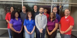 Viktory with members from the Corporate Communications Department, Maintenance Department, Flight Department, Safety Department, and Human Resources Department at Piedmont Airlines.